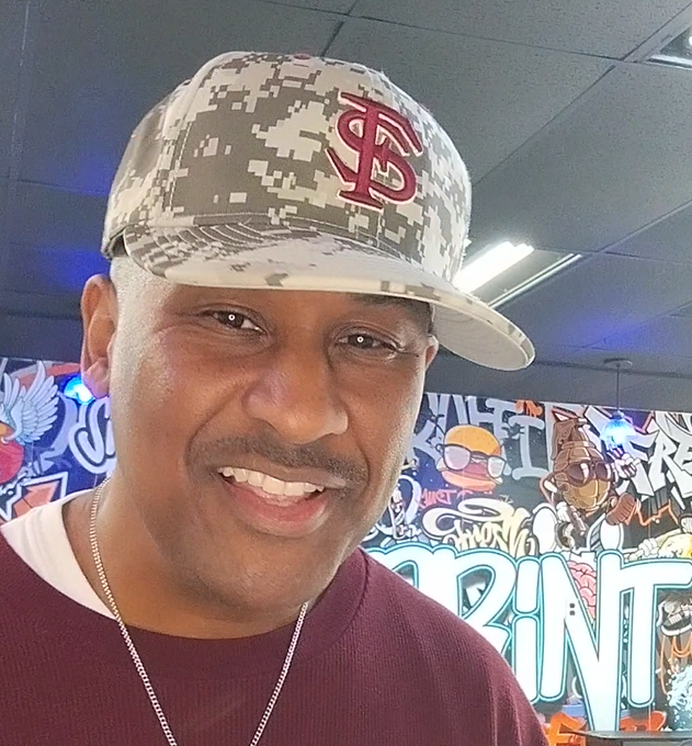 Mr D, owner and barber